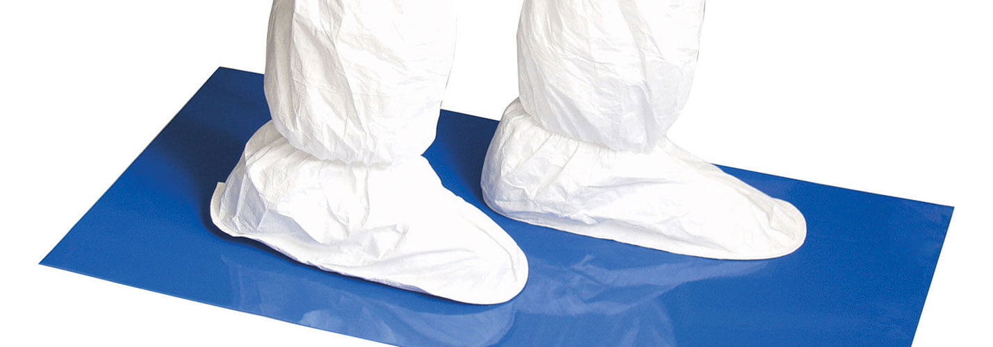 person with white booties on a blue mat