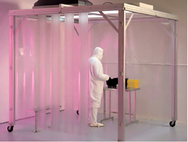 man in white hazmat suit in a softwall cleanroom